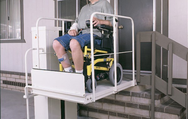 Macs PL-50 vertical platform lift with wheelchair rider