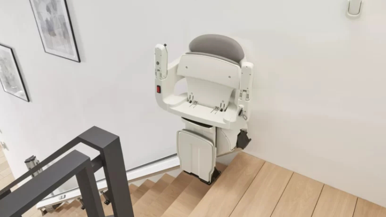 AccessBDD HomeGlide Extra stair lift with powered swivel seat and powered linked footrest - ELECTROPEDIC
