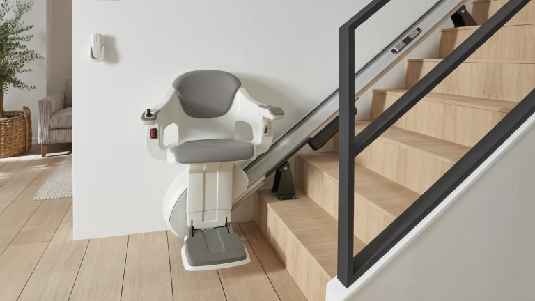AccessBDD HomeGlide stair lift padded seat and armrests - ELECTROPEDIC