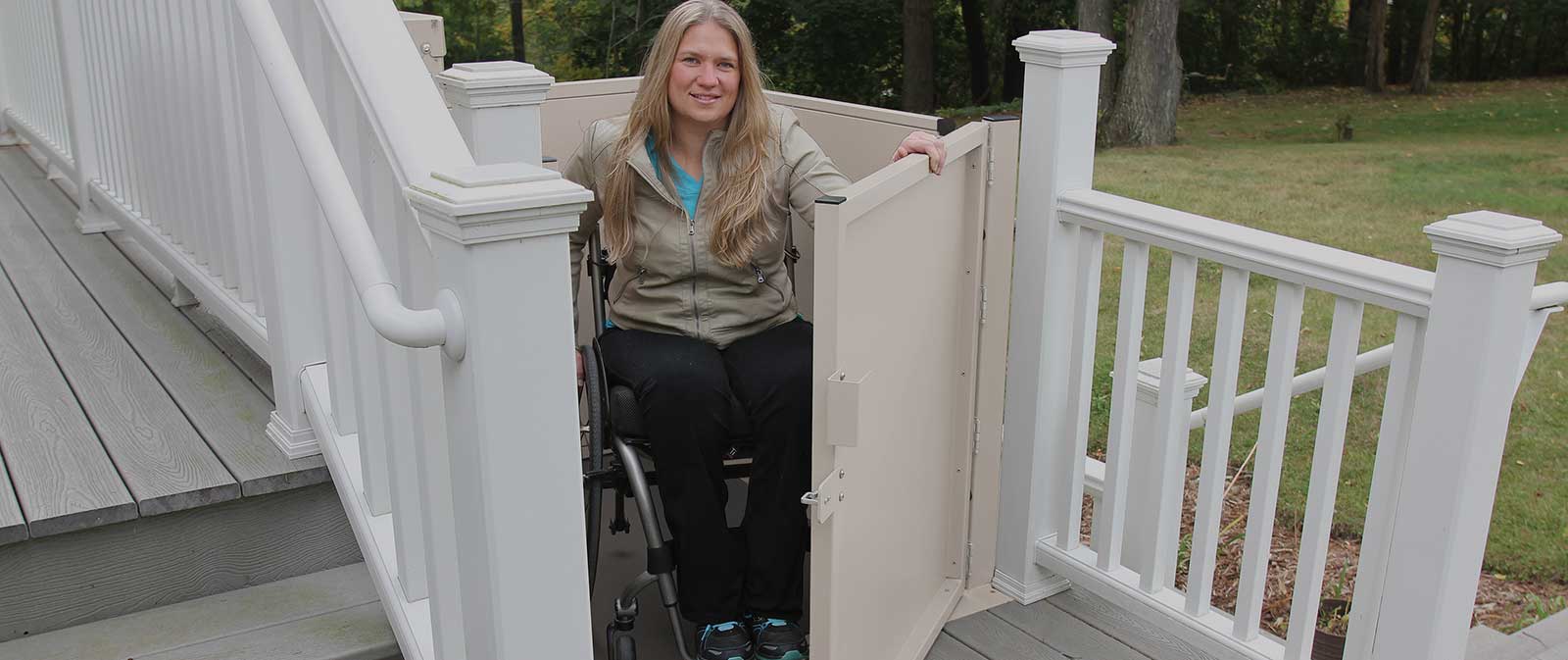 Wheelchair porch lift with under-platform safety pan and tall safety guardrails - ELECTROPEDIC